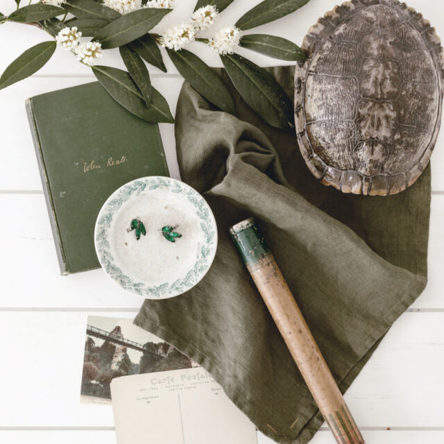 Happy St Patrick's Day! Celebrating today with a table full of  an olive table linens alongside our favorite green vintage finds.