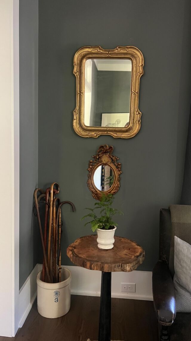 I’ve been sourcing some vintage pieces over the past few months for this nook in our Keeping Room. These mirrors, crock & old wooden canes are all bringing this cozy entertaining space to life. What do you think? Should I add one more small round mirror up top? 🪞

#vintage #antiquefurniture #antiquedecor #keepingroom #vintagehome #timelesshome #antiquemirror